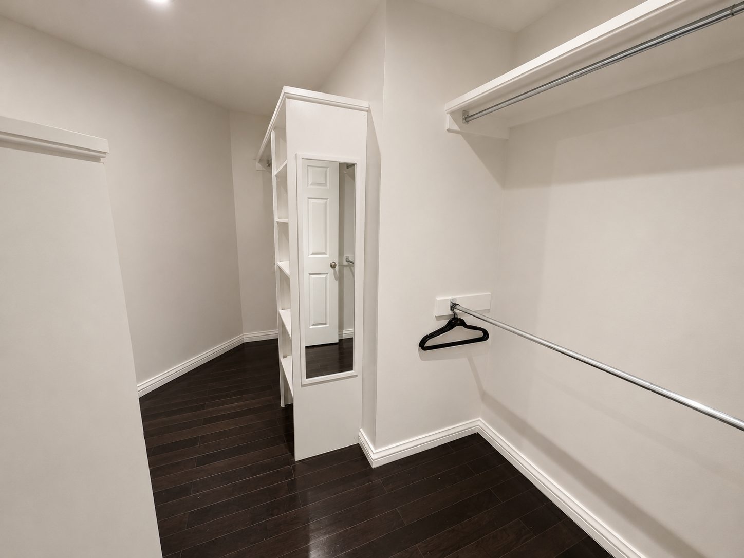 Walk-in closet with double hanging rails and shelving at Casa Rita, Bentonville AR